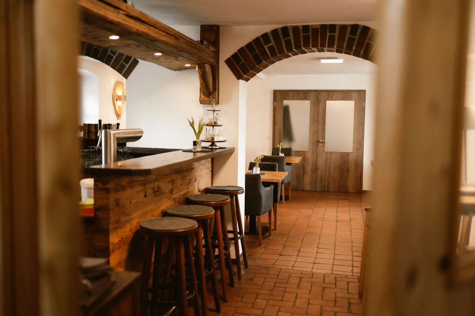 Bar and dining room beneath the historic brick vaulting