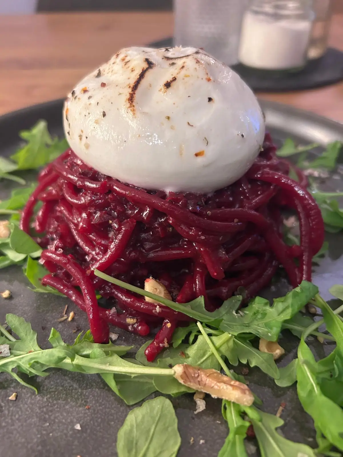 Beetroot pasta with burrata and rocket